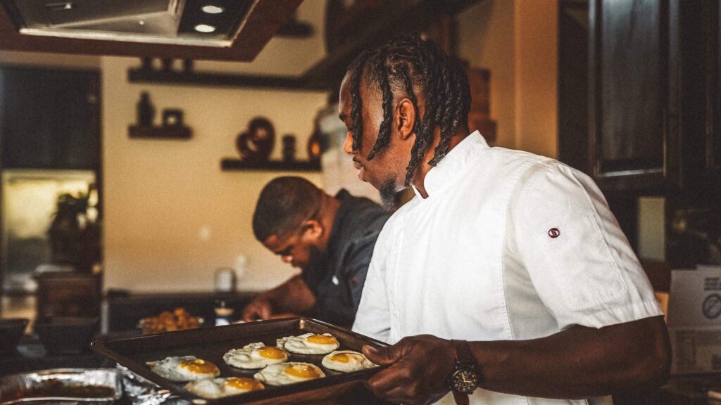 A private chef prepares a gourmet breakfast at an Uncaged Men’s Accountability Group retreat, highlighting the importance of discipline and leadership in every aspect of life.