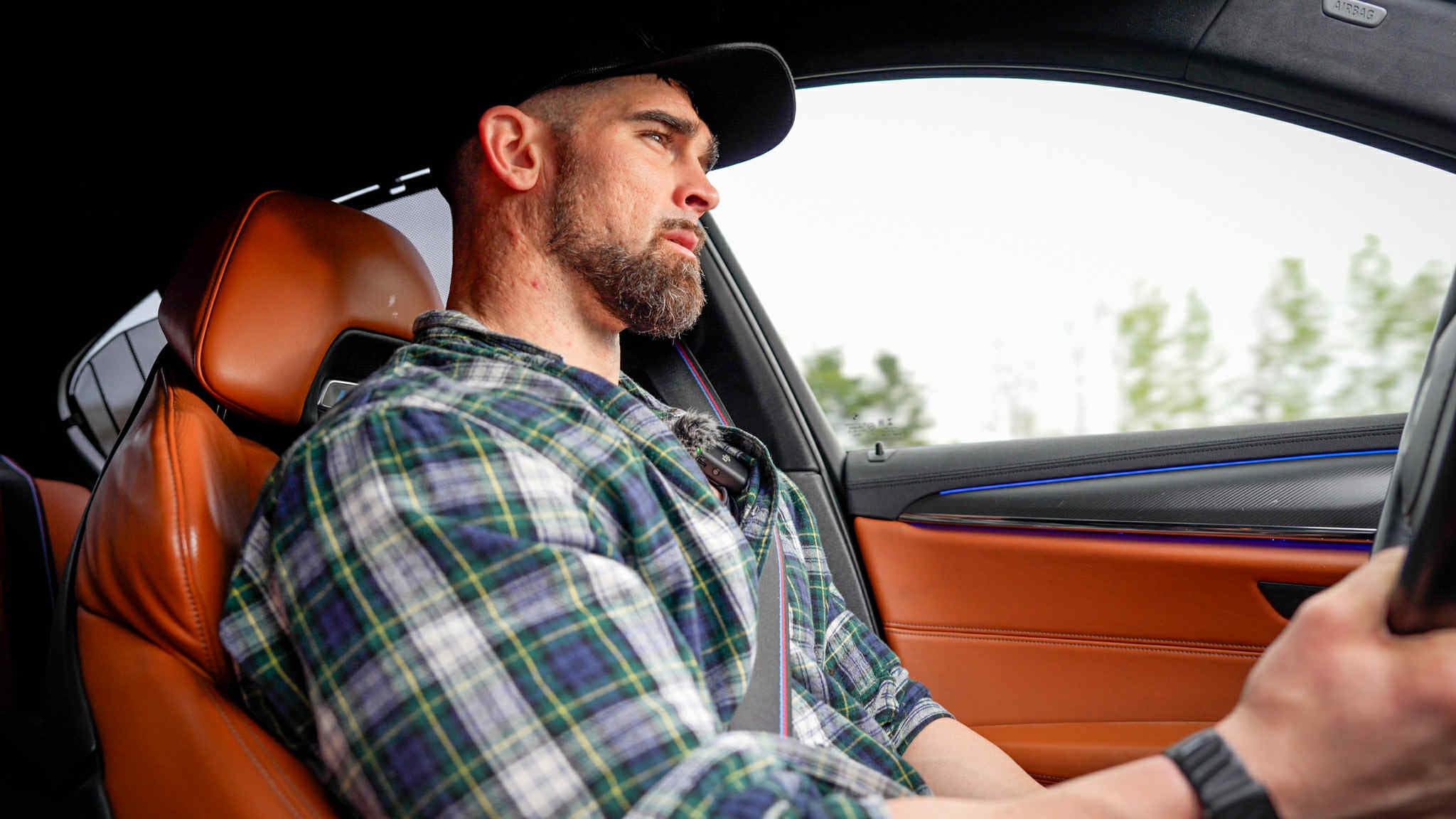 Andrew Howrigan driving, representing focus, resilience, and purpose-driven growth through the Uncaged Men’s Only Accountability Group.